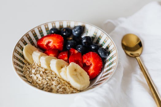 bowl of oatmeal topped with berries