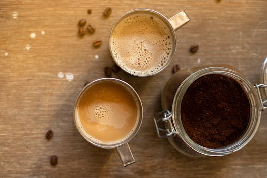 coffee beans with a steaming cup